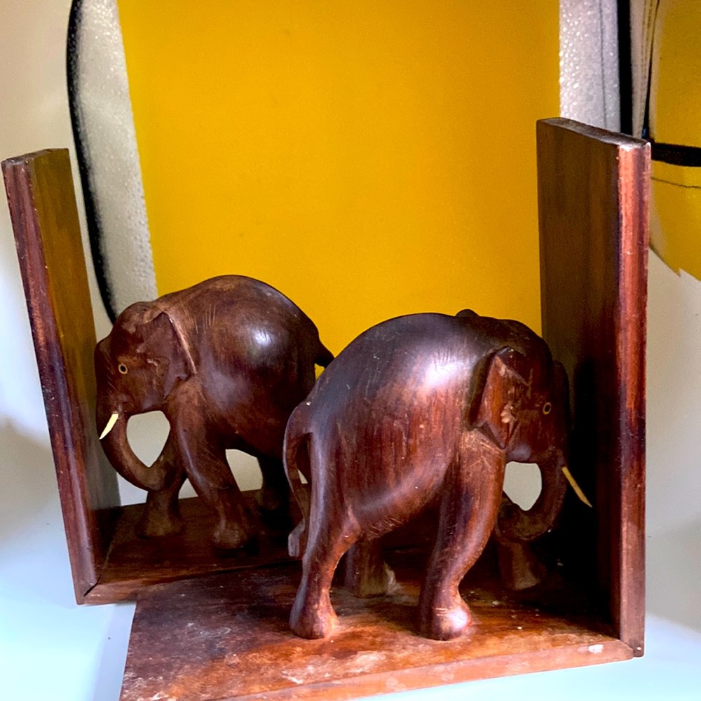Elephant bookends Hand carved. note legs in different positions in front